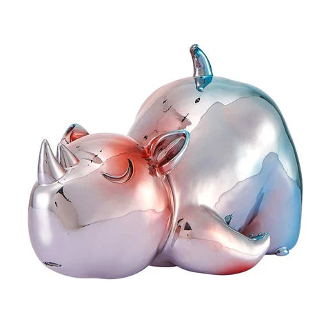 Metallic rhino-shaped object on a white background