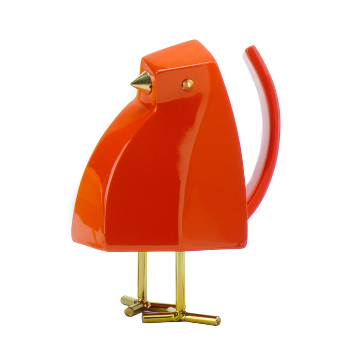 Orange bird-shaped object with gold accents on a white background