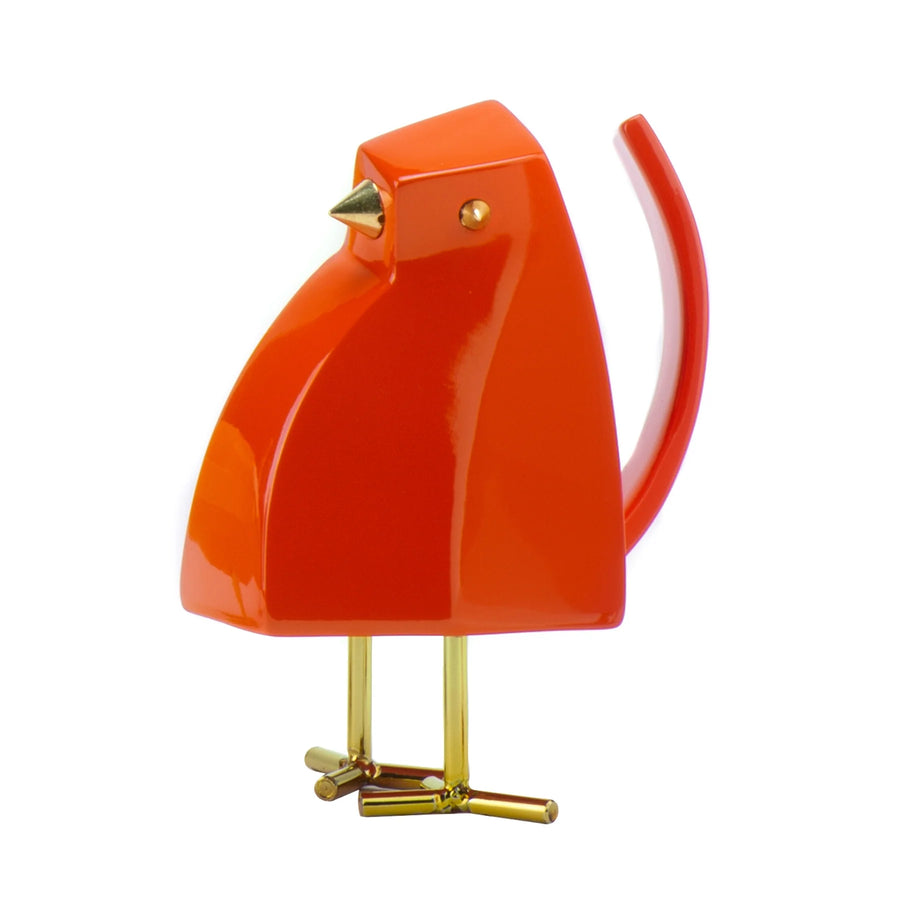 Orange bird-shaped object with gold accents on a white background