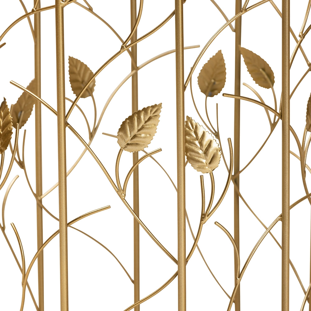 Decorative gold metal screen with leaf patterns on a white background