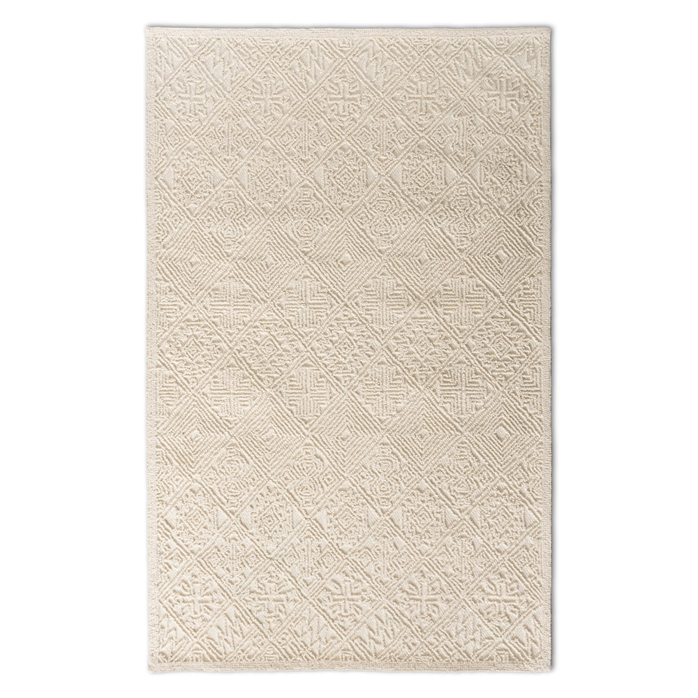 Beige patterned rug on a white background