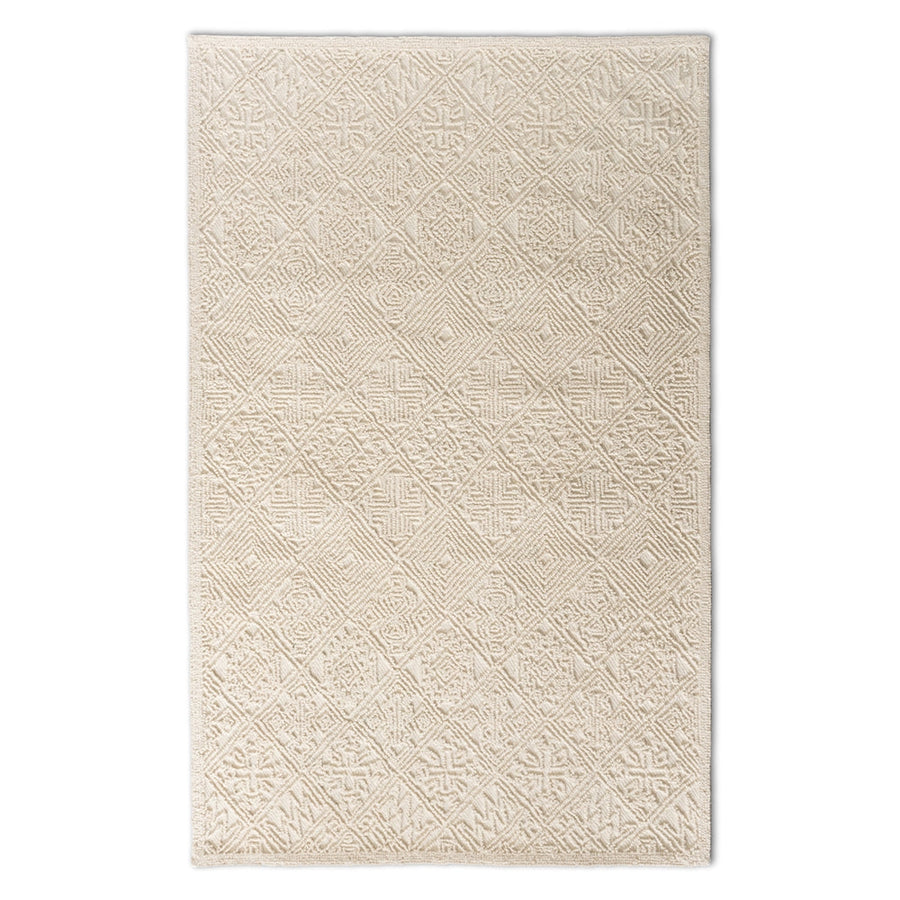 Beige patterned rug on a white background