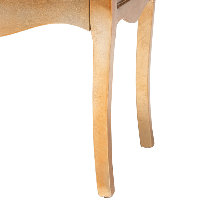 Close-up of a wooden chair leg on a white background