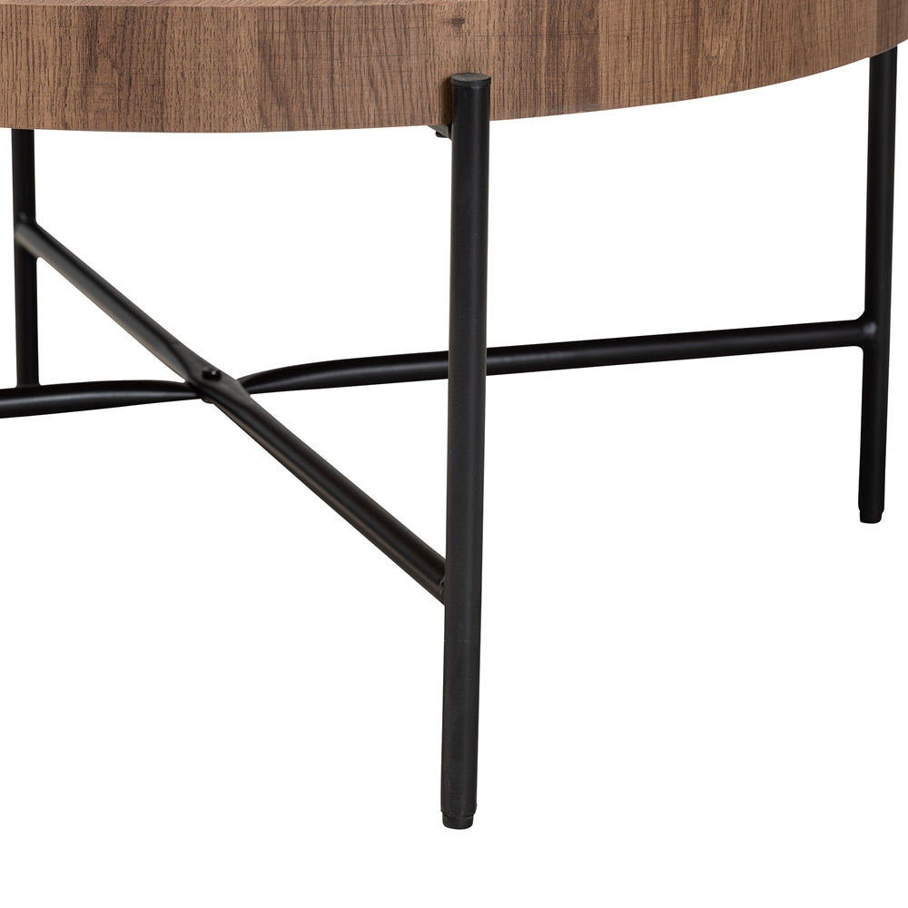 Round wooden table with black metal legs on a white background