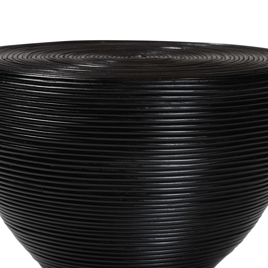 Black ribbed vase on a white background