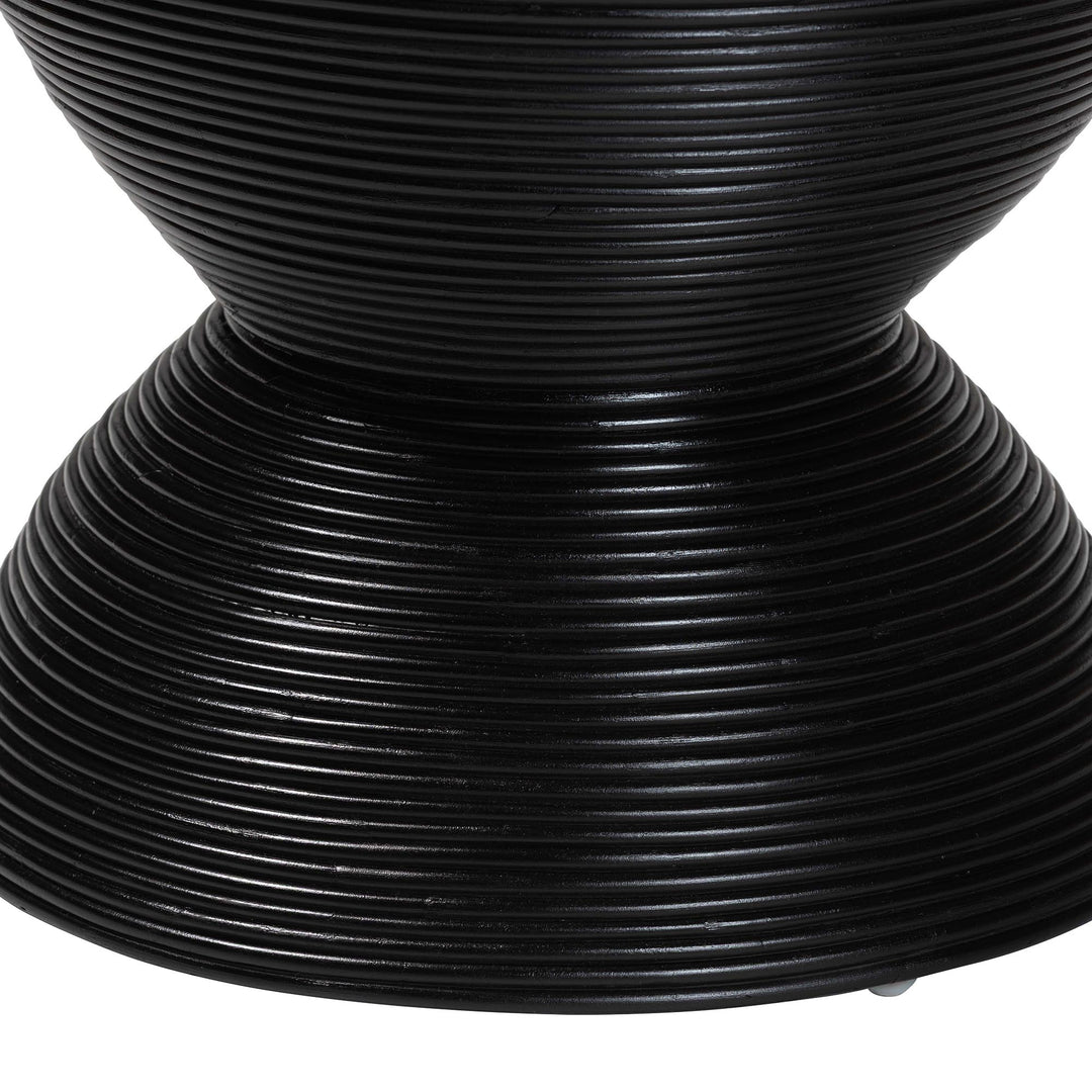 Close-up of a black woven chair seat on a white background