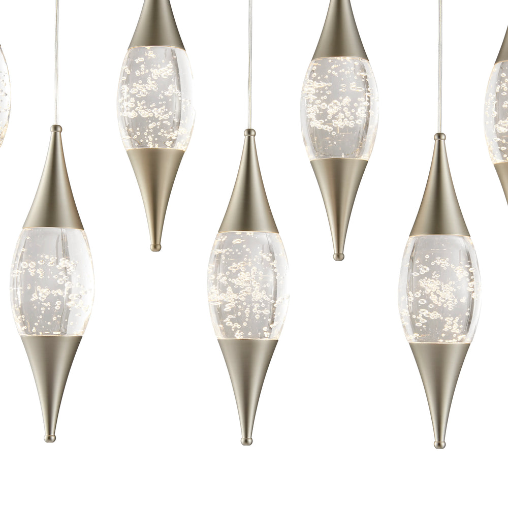Decorative hanging lights with metallic bases and clear glass shades on a white background