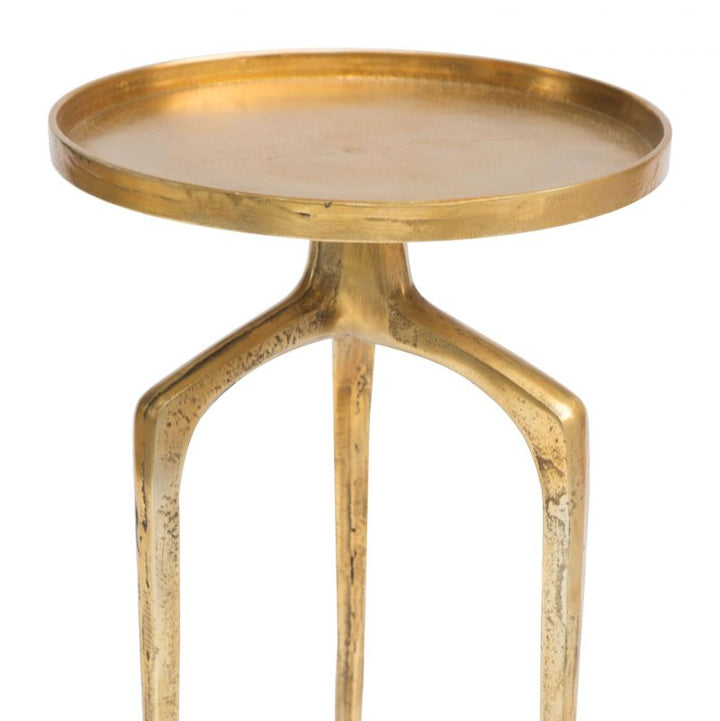Gold side table with a round tray top on a white background