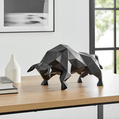 Geometric Bull Sculpture – Matte Black

The Geometric Bull Sculpture – Matte Black is a striking statement piece that exudes strength, confidence, and modern sophistication. Crafted from high-quality resin with a sleek matte black finish, this sculpture embodies the unstoppable force and resilience the bull represents—making it a powerful symbol of prosperity and determination.

Designed to complement any modern space, this sculpture adds a bold, artistic touch to your home, office. 