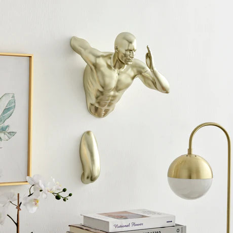 Runner Man 20" Wall Sculpture – Gold

A striking embodiment of strength, athleticism, and adventure, the Runner Man Wall Sculpture – Gold captures the dynamic essence of human motion in a bold and contemporary form. Crafted from high-quality resin with a lustrous gold finish, this sculpture makes a powerful statement in any space.

Designed with a two-part construction, it creates the illusion of speed and movement, making it a captivating focal point for walls in homes, offices. 