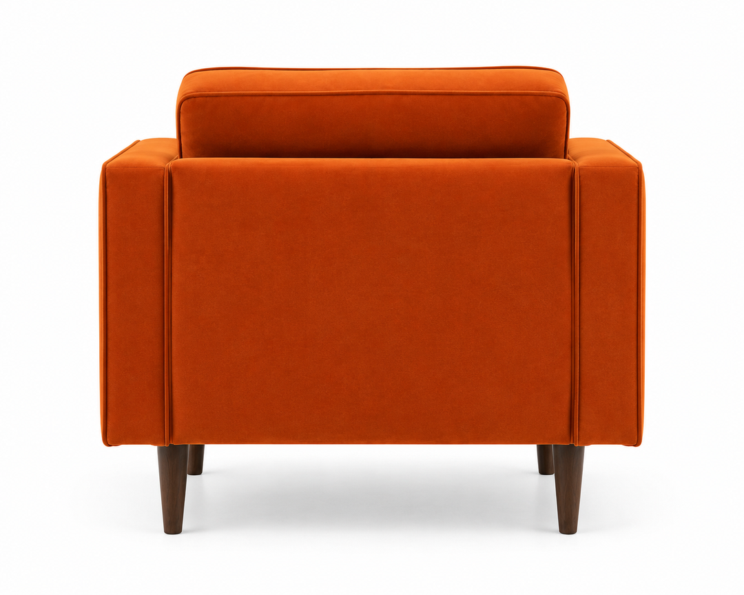 Bright orange upholstered armchair shown from the back, featuring a tall back cushion, wide armrests, and tapered dark brown wooden legs on a white background.