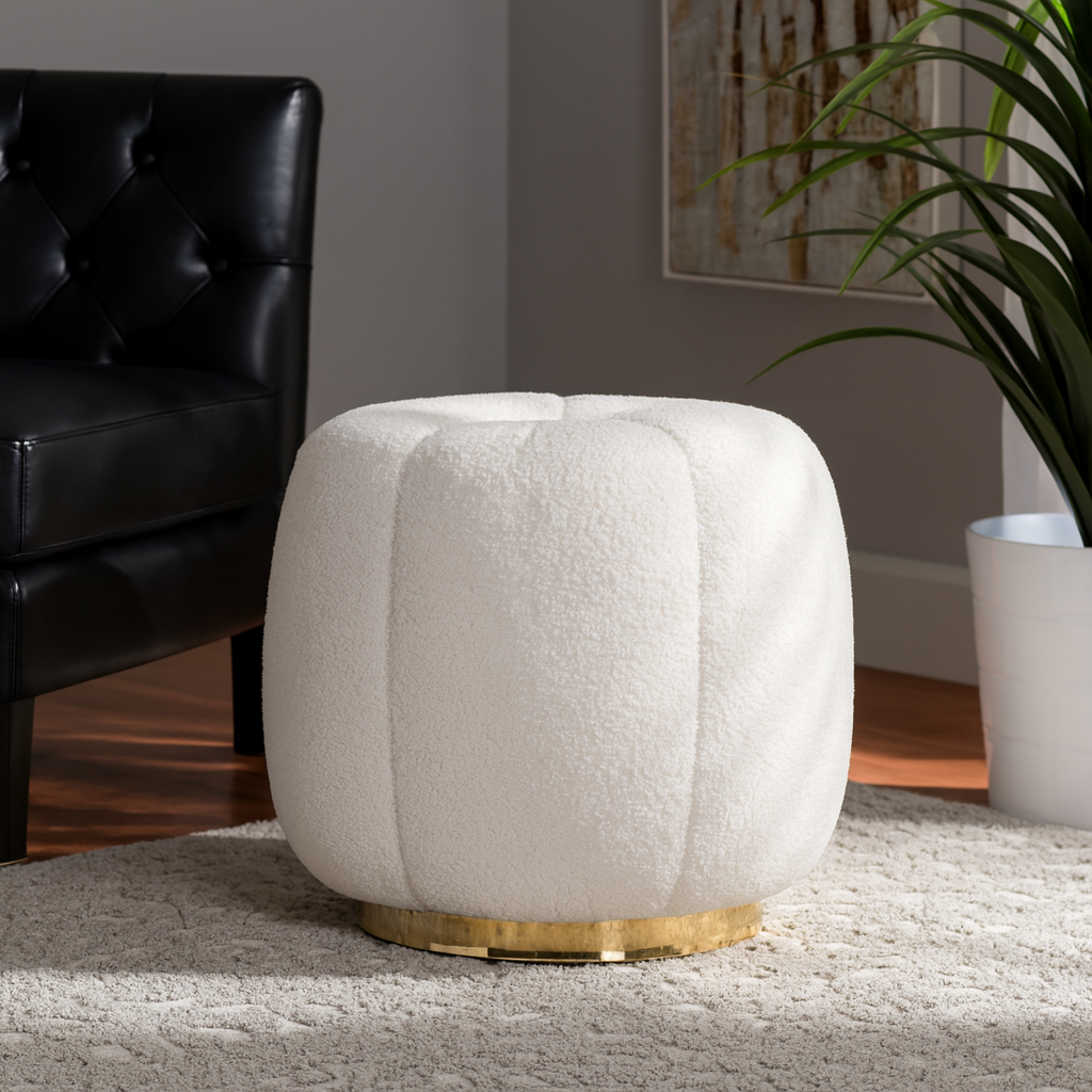White textured ottoman with gold base in a living room setting