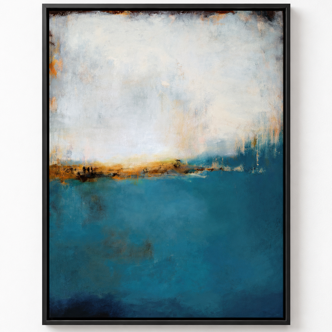 A framed abstract landscape painting featuring a textured blue sea and a hazy white sky with golden-brown accents, presented in a black frame against a white wall.
