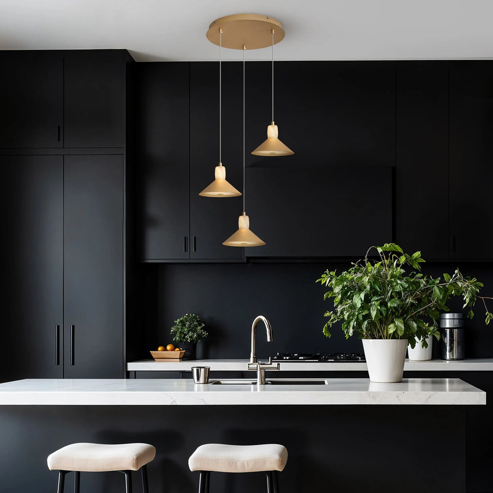Modern kitchen with black cabinets, white countertops, and pendant lights.