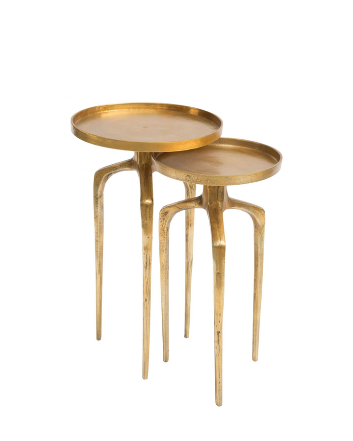 Set of two gold nesting tables on a white background