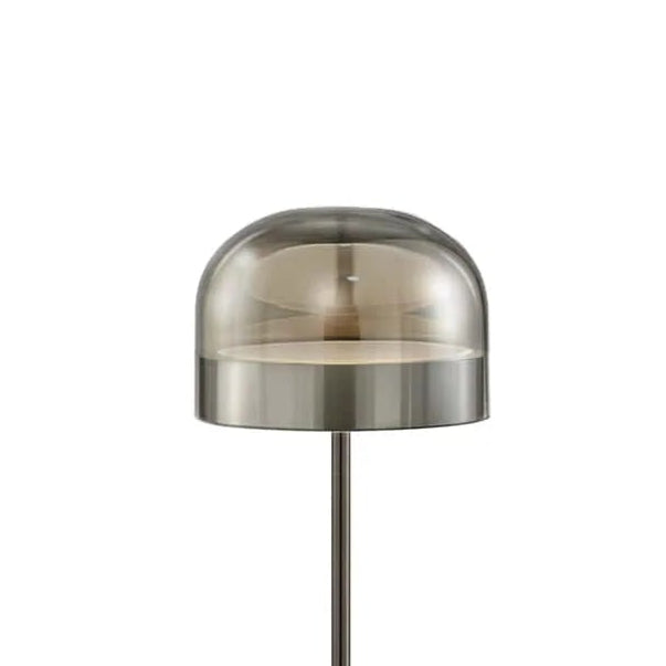 Modern floor lamp with a metallic shade on a white background