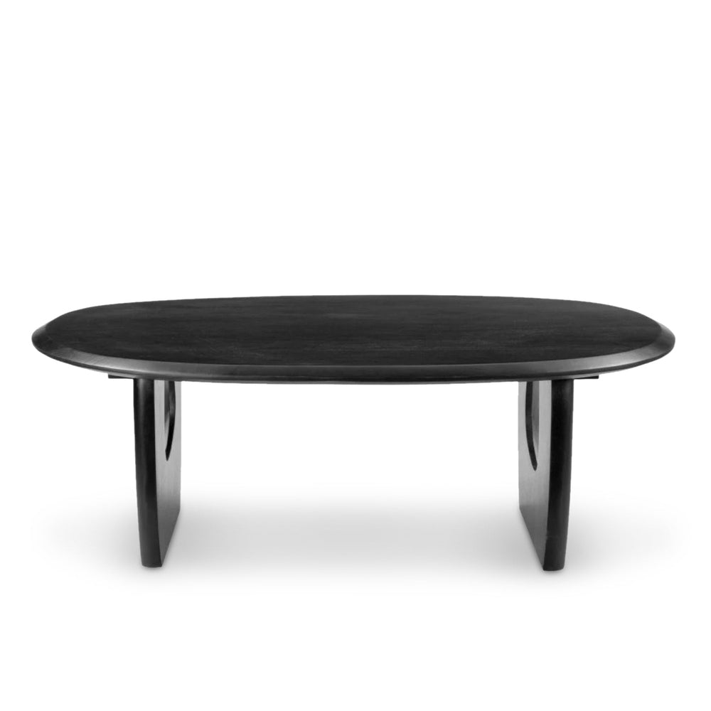 A sleek black Arasan Coffee Table made from painted Acacia wood, with a sculptural silhouette, positioned against a white background.
