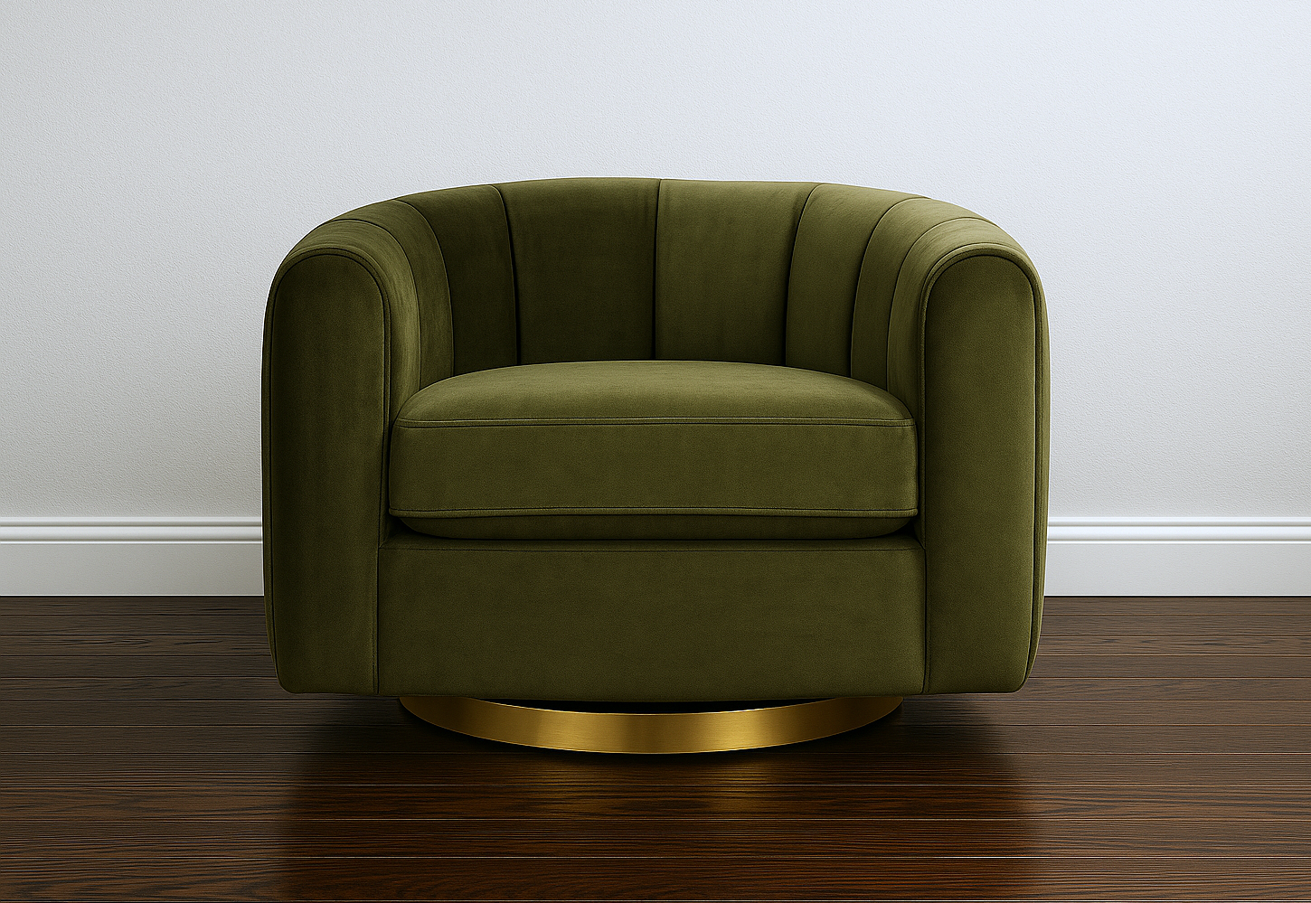 Green armchair with gold base on a wooden floor against a white wall