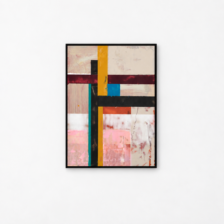 An abstract framed wall art print featuring a geometric composition of cream, pink, black, yellow, teal, and burgundy blocks, hung on a clean white wall.