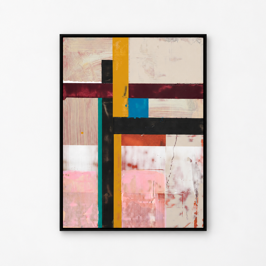 An abstract framed wall art print featuring a geometric composition of vertical and horizontal bands in mustard yellow, black, burgundy, teal, blue, pink, and cream, displayed on a clean white wall.