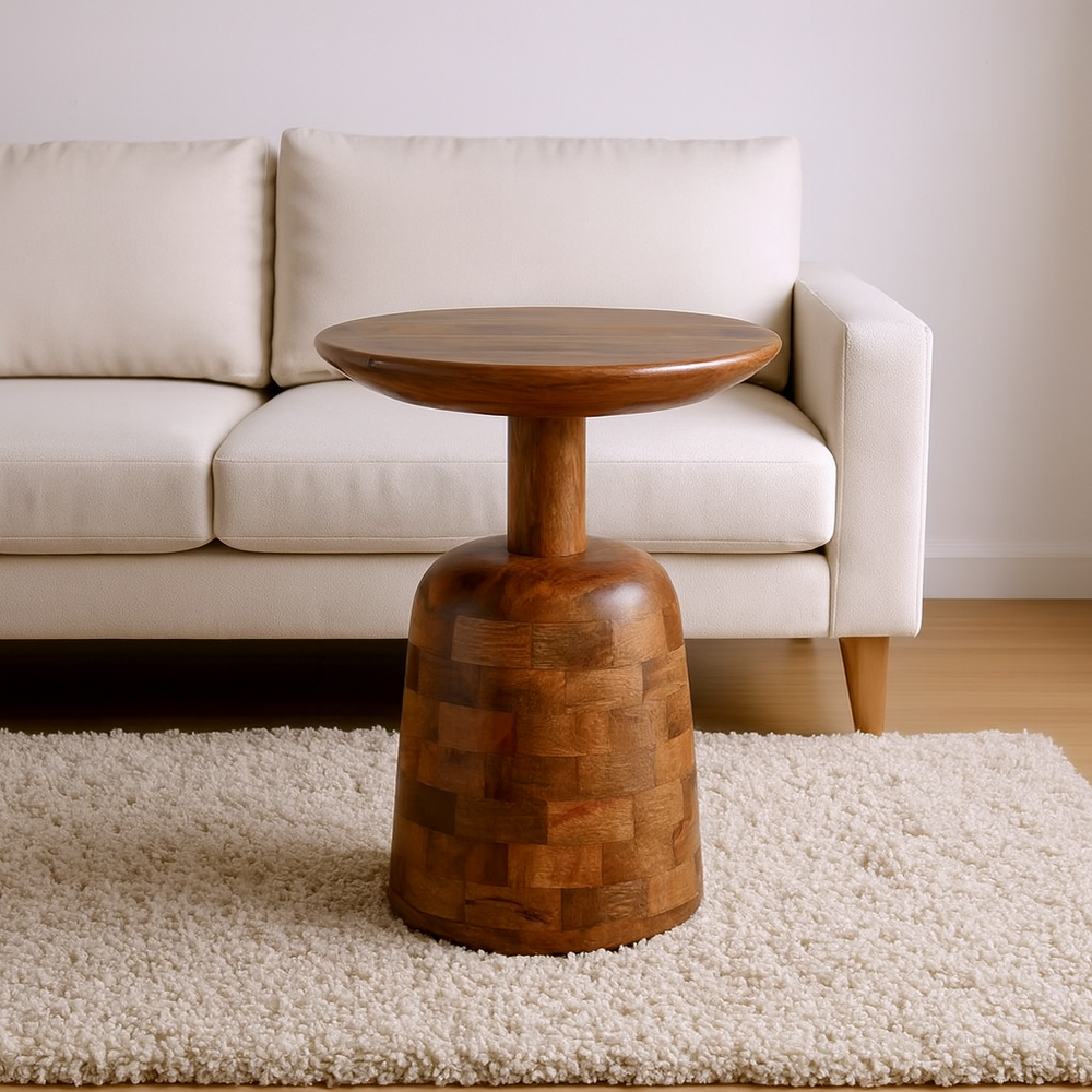 Wooden side table in front of a white sofa on a beige rug
