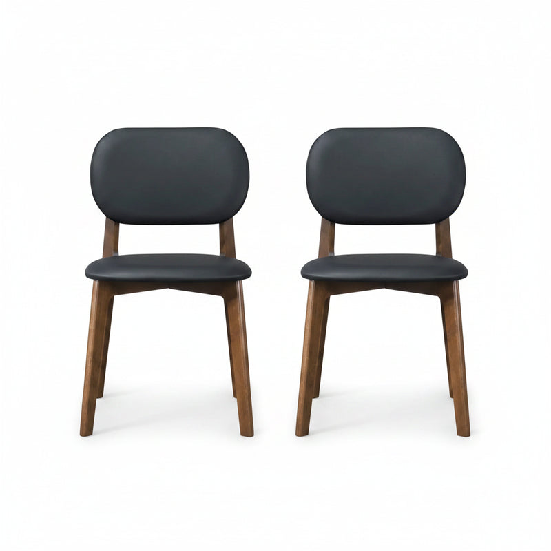 Chair with black cushioned seat and backrest on wooden legs against a white background