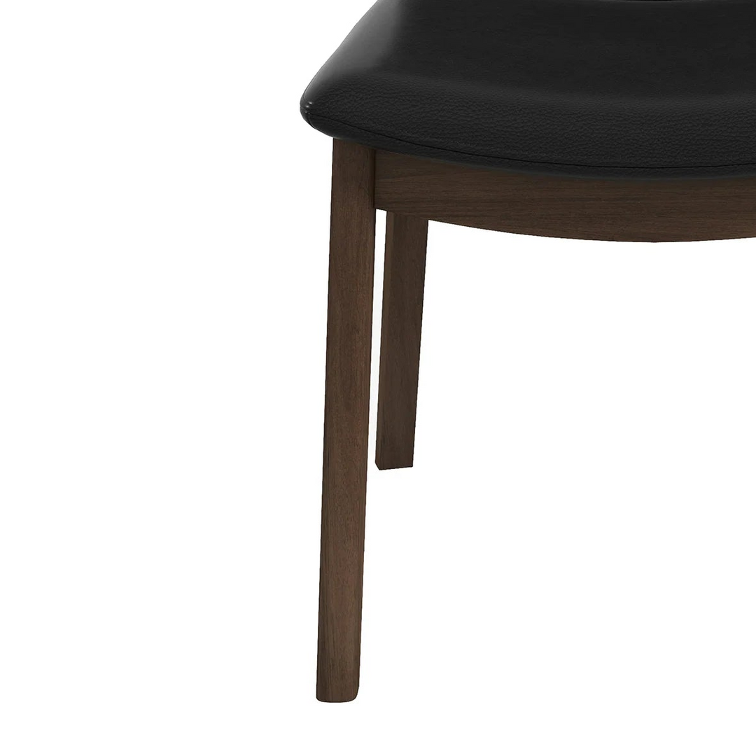 Black chair with wooden legs on a white background 