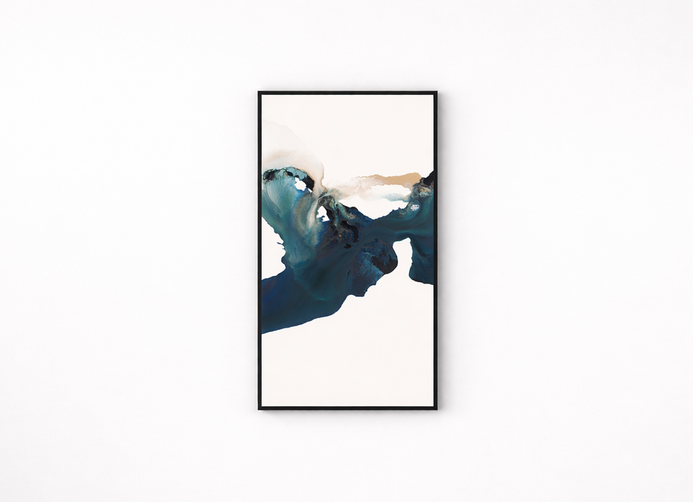 Framed abstract art piece with blue and white colors on a white background