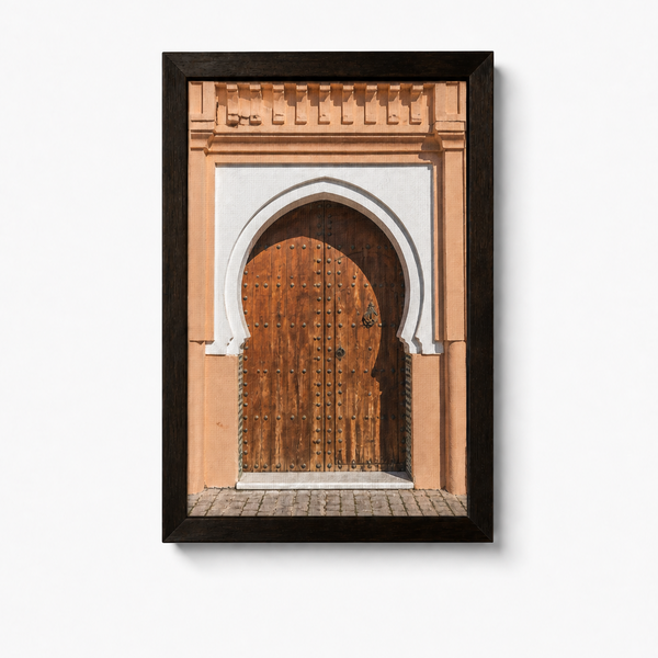 Framed artwork of a door with an arch on a white background