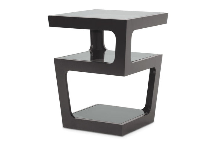 Modern black side table with glass top on a white background