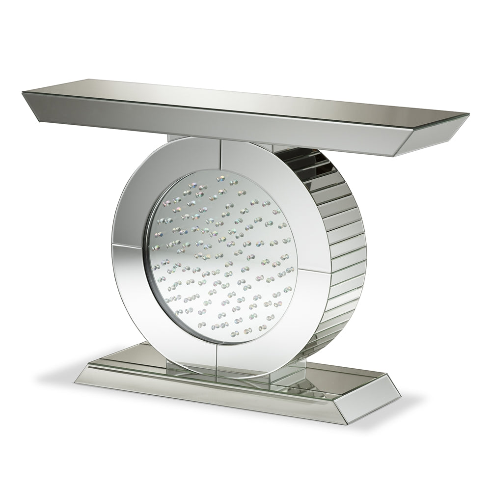 Decorative console table with circular design and reflective surface on a white background