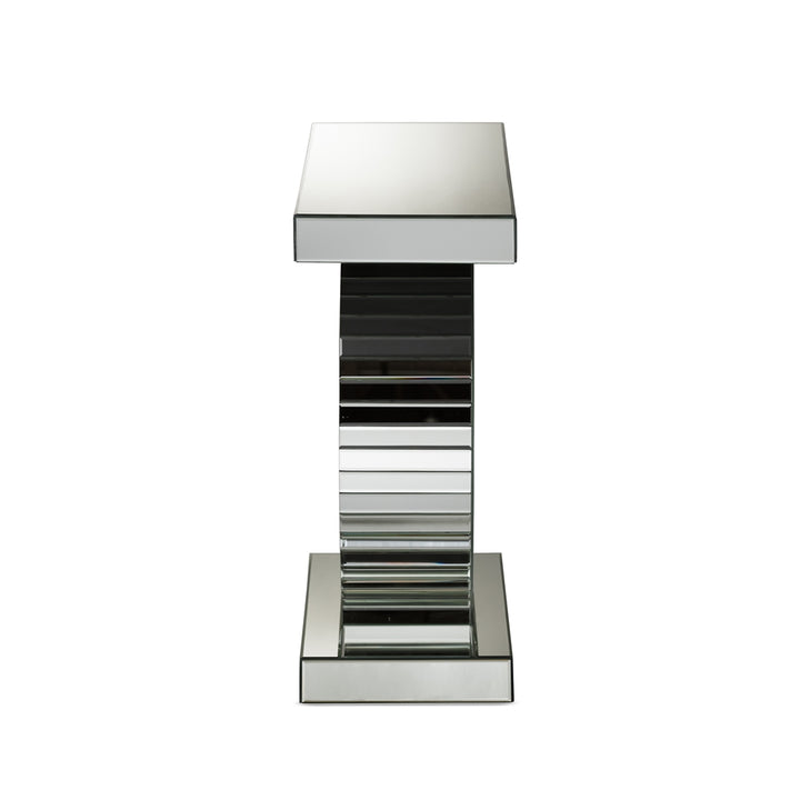 Decorative mirrored pedestal on a white background