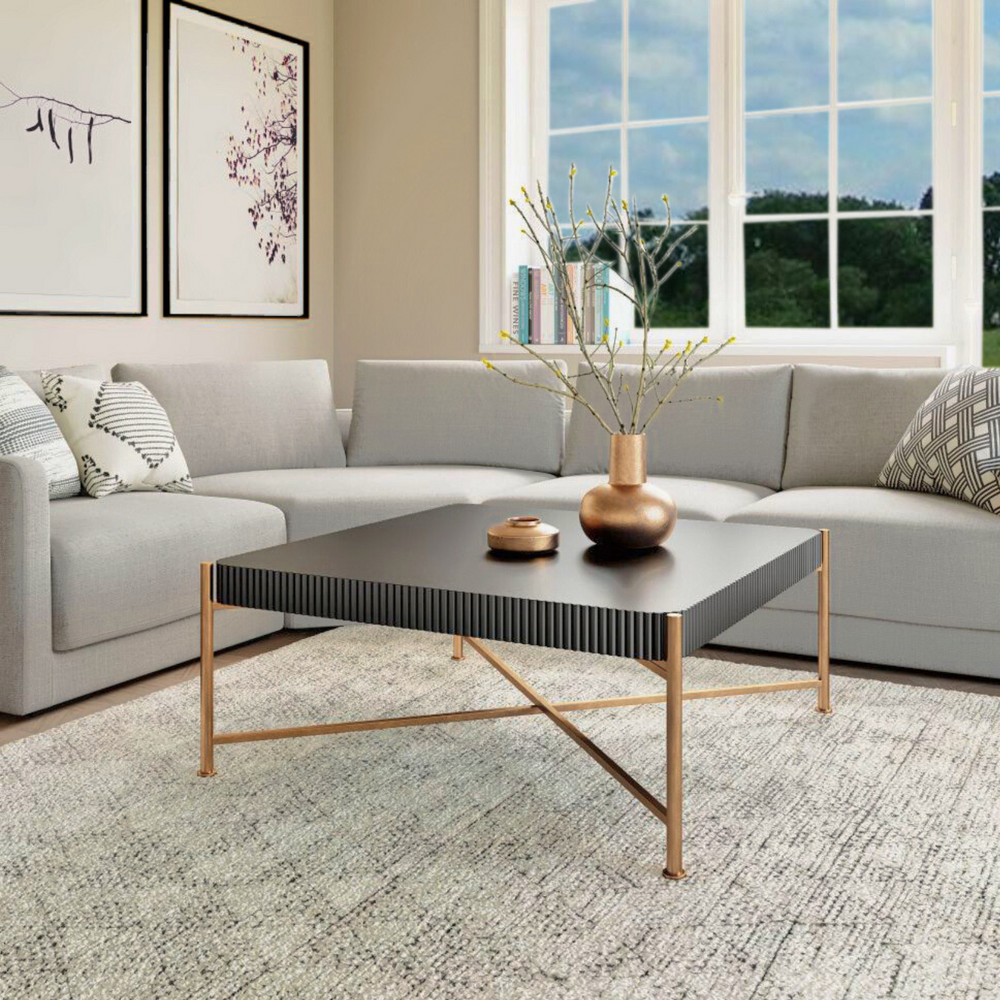 The Nazaire Coffee Table blends modern deco style with everyday functionality. Influenced by the bold geometry and luxe materials of the 1920s Art Deco movement, it features a black painted fir wood top and gold powder-coated steel legs. 