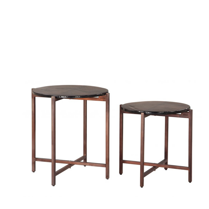 Two round side tables with dark marble tops and wooden frames on a white background