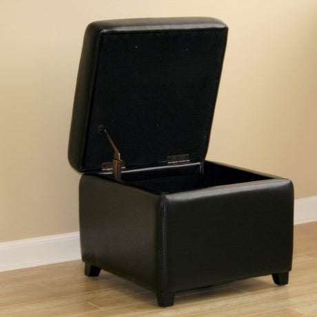 Black storage ottoman with open lid on a beige floor.