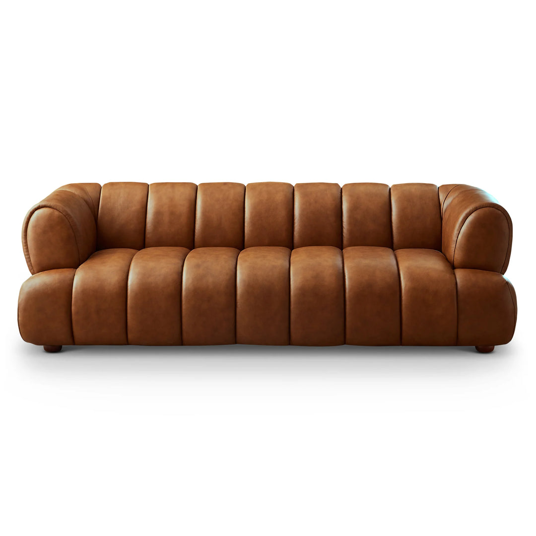 Brown leather sofa on a white background. Experience exquisite craftsmanship and design with the Jasmin Sofa (Cognac Leather), a refined centerpiece crafted for modern homes. Made from premium top-grain cowhide leather, this sofa features rich cognac tones with a protective pigmented finish for long-lasting color and exceptional wear resistance.