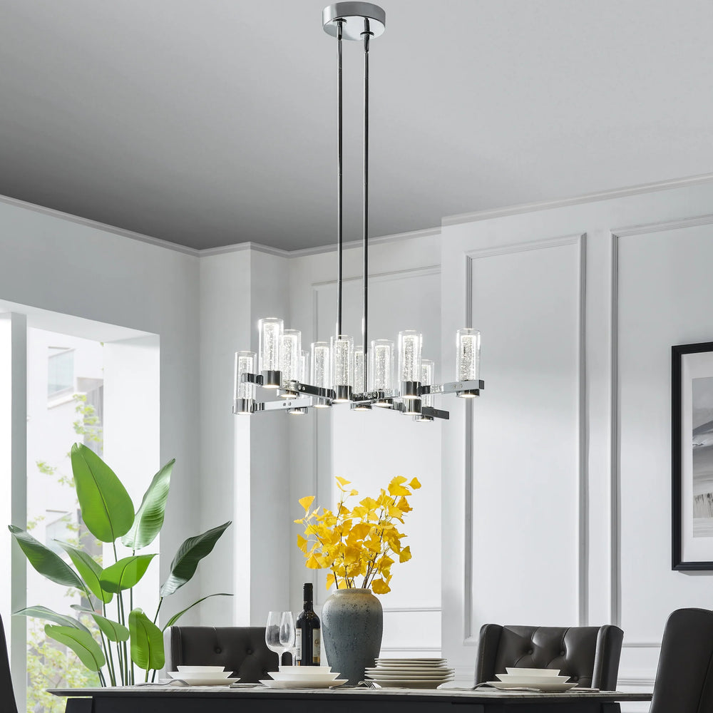 Modern chandelier in a dining room with white walls and a window.
