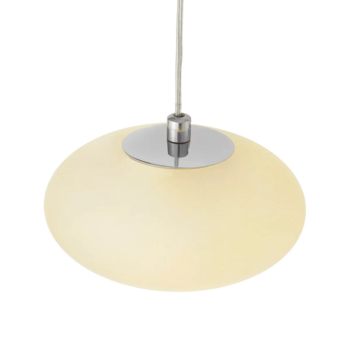 Pendant light with beige glass shade and chrome fixture on a white background