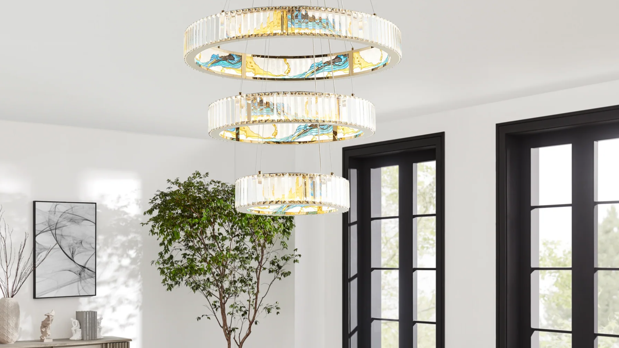 Decorative ceiling light fixture in a room with plants and large windows.