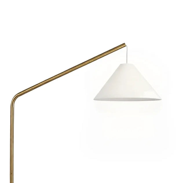 A modern floor lamp with a tapered brass base, a curved arm, and a white conical shade, shown against a plain white background.