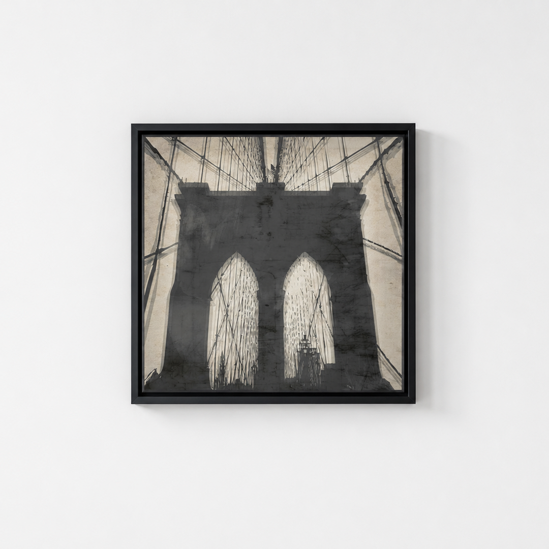 A square framed art print depicting a black and white sketch of the Brooklyn Bridge, mounted on a plain white wall.