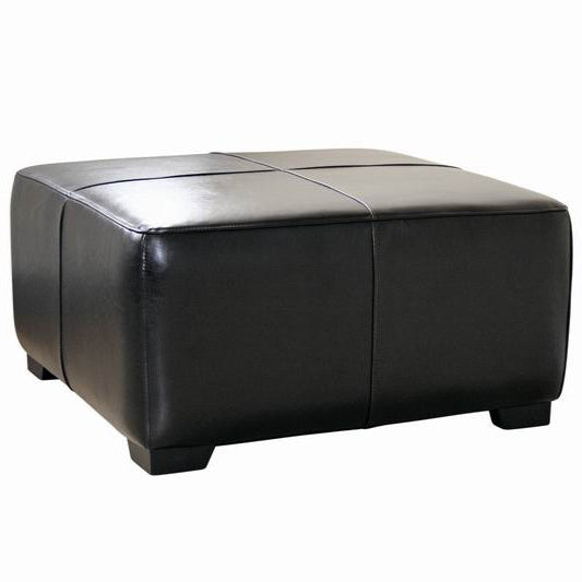 Black leather ottoman on a white background